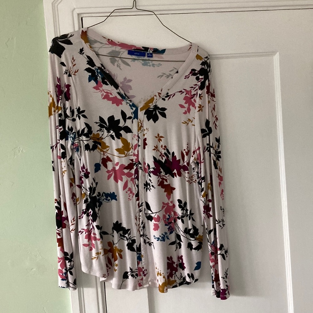 Ladies top w/ multiple fall color leaves on white background